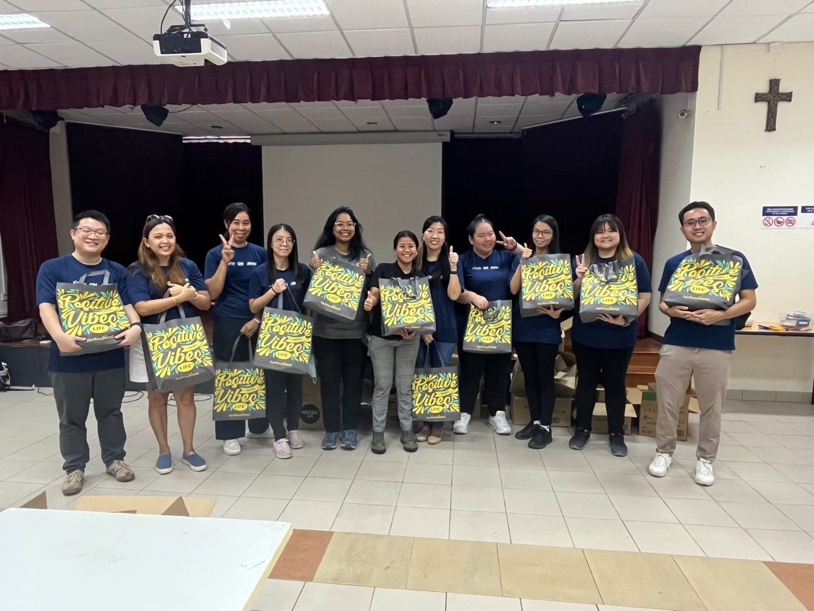 Exion volunteers packing care bags at a community centre