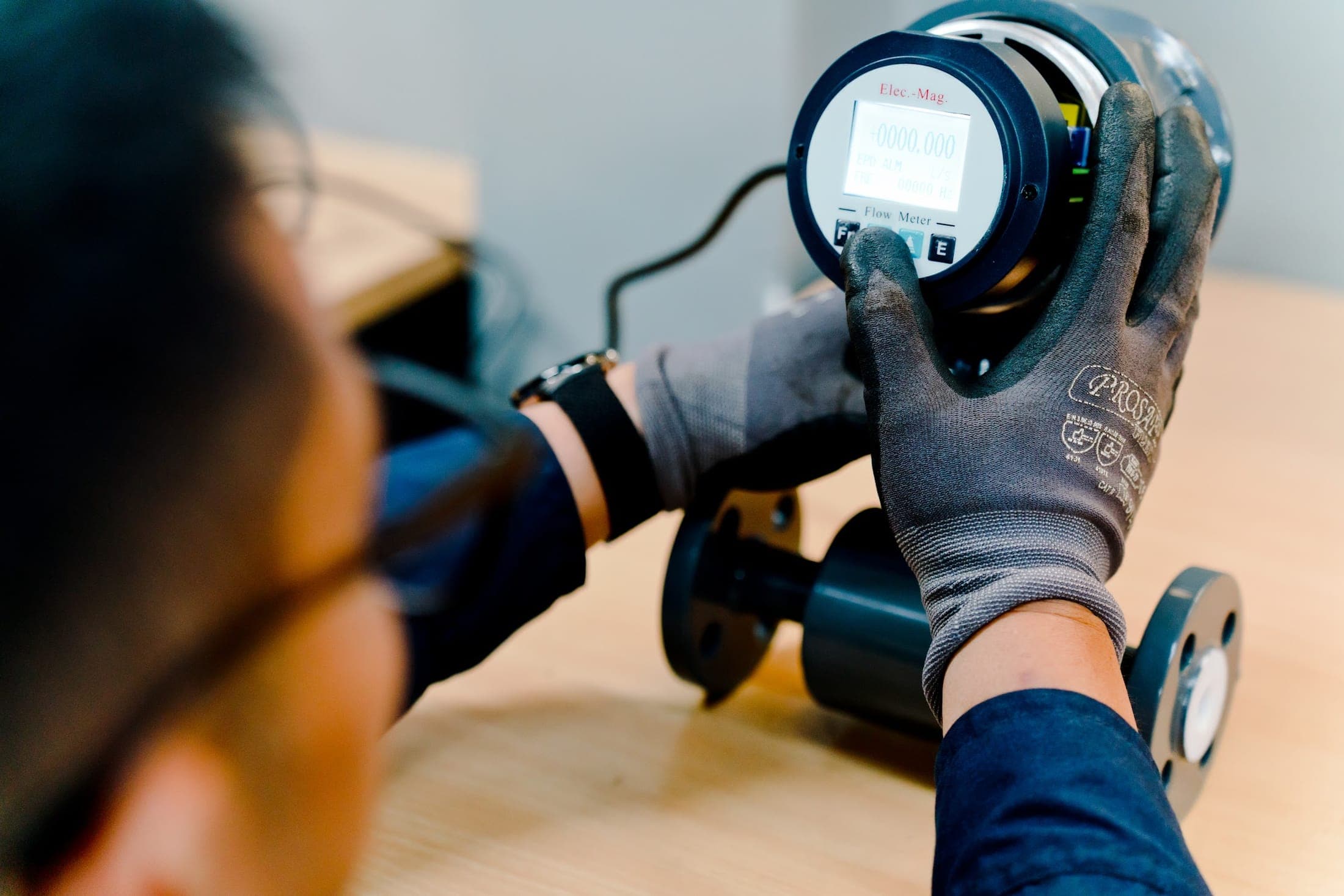 Exion engineer verifying an ultrasonic flow meter on site