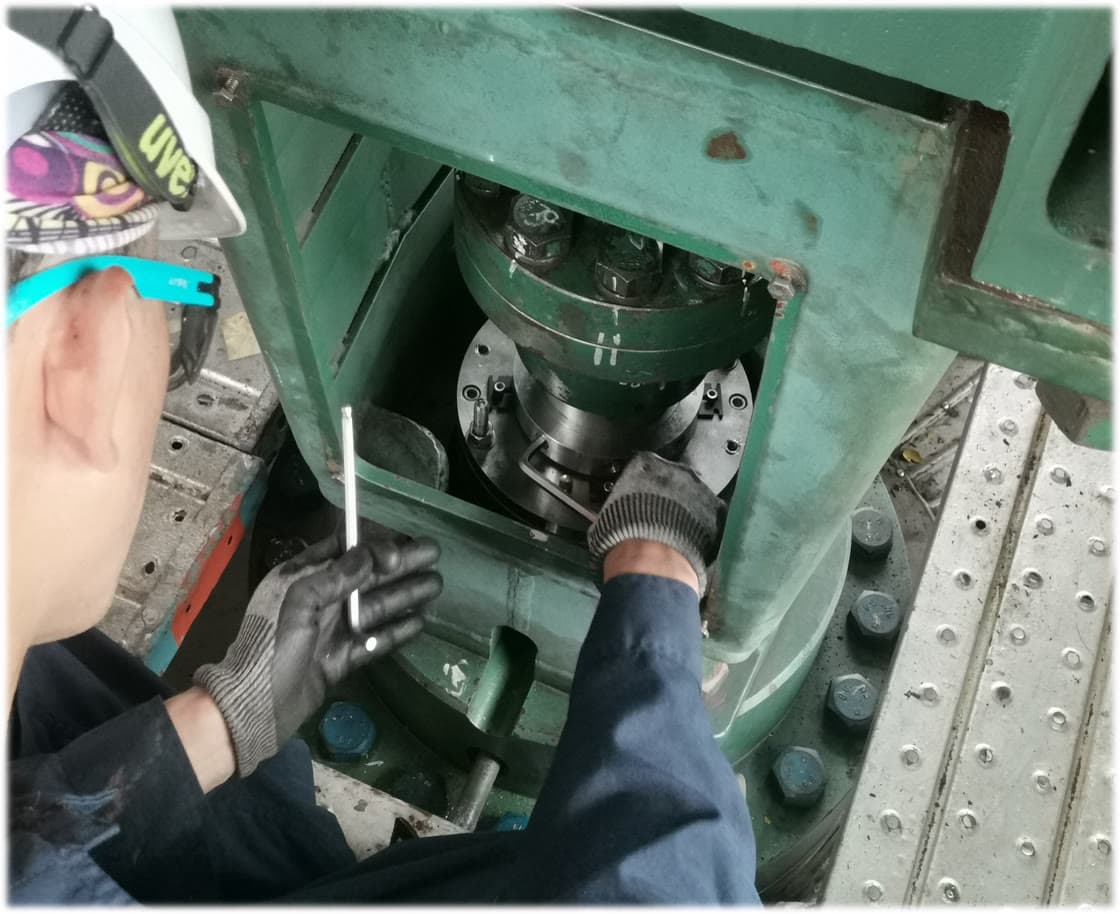 Exion engineer performing on-site analysis on a vertical pump