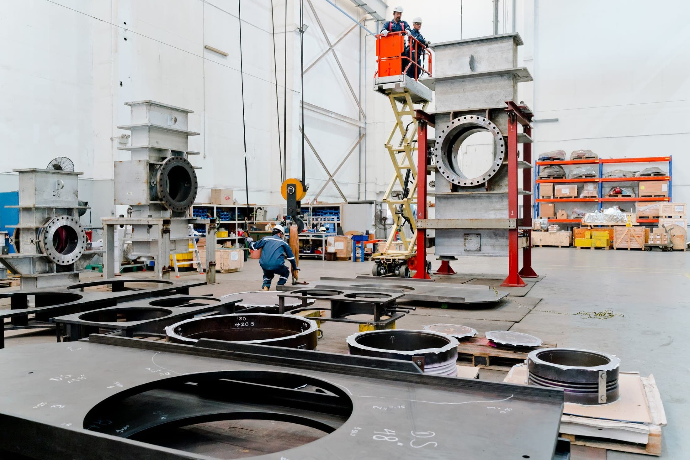 Exion fabrication hall with large valve bodies under overhead cranes
